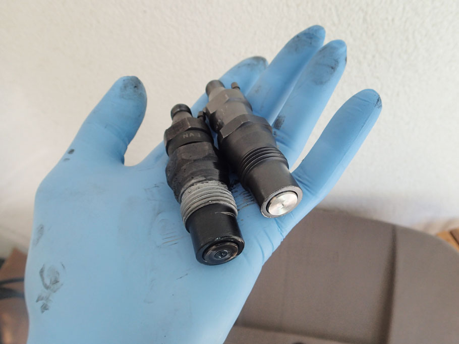 Replacing the injectors. Old cruddy injector is on the left, and new one on the right.
