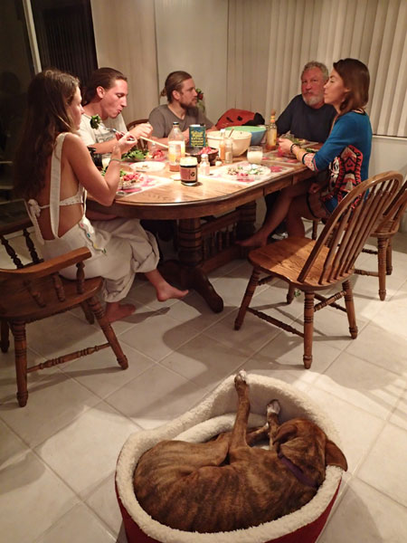 Penny, Emily and Corey's dog, gets cozy while the rest of us enjoy a dinner with friends.
