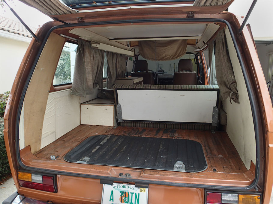 Here's the van with the rear side and upper cabinet removed. Duwan suggested tinting the windows. So I put tinted film on the left rear while the cabinet was out. I also replaced the left rear contact paper.