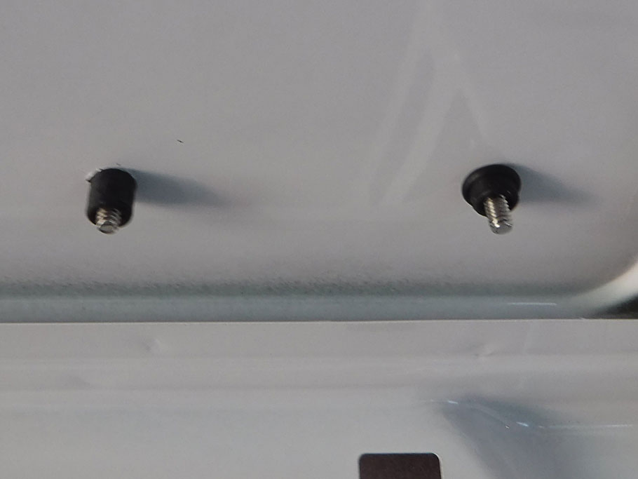 We used well nuts to mount the panels. A nut is embedded in a rubber cylinder. Bolt is started into the nut from above (left). Tightening the bolt compresses the rubber (right) making a secure connection. The rubber seal keeps rain water from coming in. 
