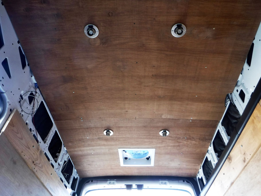 Here is the ceiling with overhead lights and the trim for the exhaust fan installed. 